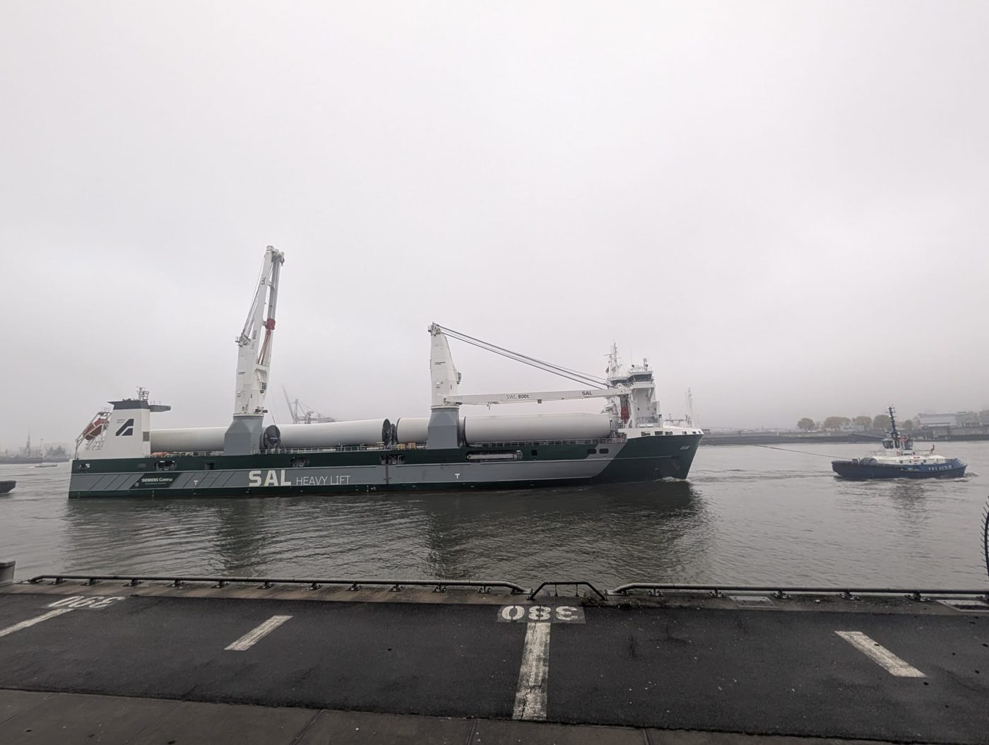 SAL heavy-lift vessel carrying wind turbine tower sections on the river Elbe